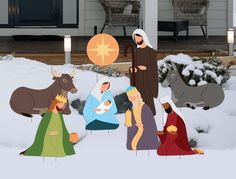 the nativity scene is depicted in front of a house