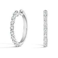 Luxe Marseille Diamond Hoop Ears - 18K White Gold. Stunning yet effortless, these beautiful hoop earrings feature glistening round diamonds in sophisticated shared prong settings (5/8 total carat weight). Elegant Hoop Earrings With Brilliant Cut, Oval Diamond Hoop Earrings With Prong Setting, Diamond White Classic Hoop Earrings, Timeless White Gold Hoop Earrings For Anniversary, Wedding Hoop Huggie Earrings With Single-cut Diamonds, Diamond Huggie Earrings With Halo Design, Classic Diamond White Hoop Earrings, Timeless White Gold Hoop Earrings With Brilliant Cut, Timeless Brilliant Cut White Gold Hoop Earrings