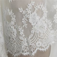 Beautiful Soft Eyelash French lace fabric This is a new style in high quality. It with Scalloped on both sides Great for make wedding dress, evening gown, Costume, cocktail dress Color: White Width - 59 inches, Length - 118 inches (3yards) This Listing Fabric is 3 yards Length It is fabric product, not include dress Wholesale acceptable, please convo me Shipping Time: United Sates: 10-15 working days United Kingdom:10-15 working days Canada: 10-15working days Australia: 10-15 working days Asia:4 Cream Lace Dress With Scalloped Details, Cream Lace Dress With Lace Back, Cream Lace Dress With Delicate Details, Cream Lace Tulle Fabric With Lace Trim, Cream Tulle Fabric With Lace Trim, Cream Tulle Fabric With Crochet Lace Detail, Cream Tulle Fabric With Crochet Lace, Wedding Tulle Fabric With Lace Patchwork, White Scalloped Lace Dress