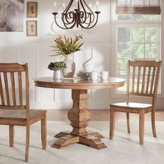 a dining room table and chairs with different color swatches on the wall behind them