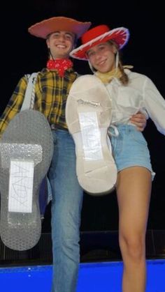 two people in cowboy hats pose for a photo