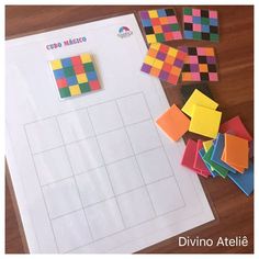 several different colored squares and stickers on top of a sheet of paper with the words diyino atelife written in spanish