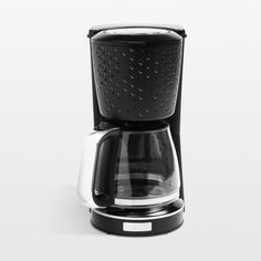 a black and white coffee maker sitting on top of a counter