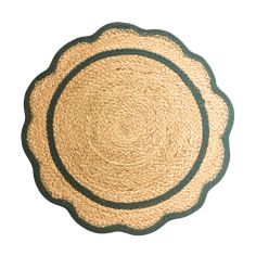 a round rug with green trim on the bottom and black border in the middle, against a white background