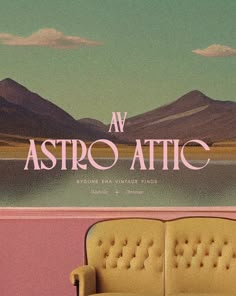 a yellow couch sitting in front of a pink wall with the words av astro attic on it