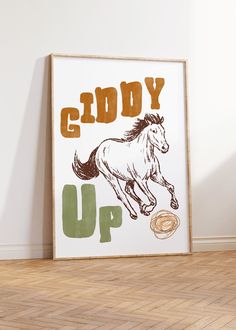 a white horse is galloping on the floor next to a sign that says, giddy up