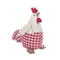 a stuffed chicken sitting in a red and white checkered cloth basket with a tag on it's ear