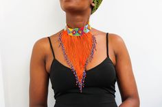 African choker necklace, Beaded choker necklace, Beaded Zulu Necklace, Statement necklace, Christmas gift for her, Tribal necklace, Mom gift A 100% handmade in Kenya necklace. Can fit any body type as it layers well with the body. *Color: orange *Necklace height:  6 inch/15 cm *Neck size length : 13.5 inch / 34 cm (Adjustable and extends up to 16 inch/ 41cm 3-5 days delivery via shipping via DHL Express  Shipping fee is for the first item only and additional items ship for free. To continue shopping, kindly click here: nkoroicrafts.etsy.com Thank you for visiting! Traditional Beaded Chain Choker, Handmade Beaded Choker For Festive Occasions, Handmade Festive Beaded Choker Necklace, Handmade Festive Beaded Choker, Orange Beaded Choker For Festivals, Orange Beaded Choker Necklace For Festivals, Festival Beaded Choker Necklace Gift, Festival Gift Beaded Choker Necklaces, Festival Gift Beaded Choker Necklace