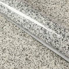 a close up view of a counter top with black and white speckles on it