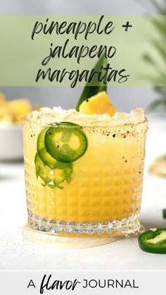 a drink with cucumber garnish in it and the words pineapple + alpeno margaritas