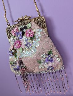 This gorgeous vintage bag is in perfect condition! A true find!  Embellished with beautiful French lace, hand beading and a gorgeous gold frame, complete with an intricate snap closure and pink satin interior.  SWOONING! 21.5 inch gold metal strap  Bag Dimensions: 8in x 7.5in Traditional Handmade Bags For Vintage Events, Traditional Pink Shoulder Bag For Evening, Embellished Pink Shoulder Bag For Wedding, Pink Embellished Shoulder Bag For Wedding, Vintage Pink Bags, Vintage Embellished Bag As Fashion Accessory, Vintage Embellished Shoulder Bag For Wedding, Vintage Pink Bags For Wedding, Vintage Pink Bags For Weddings