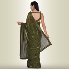 Introducing the One Minute Sequin Saree in Dark Green, a masterpiece crafted from luxurious georgette. This saree is not just a garment; it's an experience in effortless elegance. With a pre-stitched blouse that guarantees a perfect fit, getting ready has never been this convenient.The saree belt adds a touch of grace and sophistication to your ensemble, transforming you into the epitome of style in minutes. The mesmerizing sequin work catches the light in all the right ways, ensuring you shine Reception Outfits, Saree With Belt, Sequin Saree, Sari Blouse, Single Piece, Exclusive Collection, Salwar Kameez, Indian Outfits, Dark Green