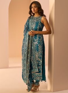 Our Dark Teal Embroidered Straight Suit includes a net top with satin inner, satin bottom, and a net dupatta. Embroidery is present on this style using zari, sequins, and stone work. Like all of our pieces, this piece is made in India and checked by hand to ensure high quality. Sleeveless Salwar Kameez For Eid Reception, Sleeveless Organza Sets For Eid, Silk Churidar With Mirror Work For Reception, Semi-stitched Sleeveless Salwar Kameez With Sheer Dupatta, Unstitched Sleeveless Salwar Kameez With Sheer Dupatta, Sleeveless Traditional Wear With Sheer Dupatta For Festive Occasions, Festive Sleeveless Traditional Wear With Sheer Dupatta, Festive Sleeveless Salwar Kameez With Sheer Dupatta, Silk Unstitched Suit For Reception And Navratri