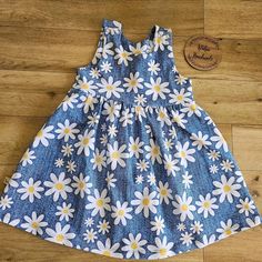 denim blue effect with white daisies cotton jersey pinafore dress   bodice lined in cotton jersey and fastens on shoulders with metal  kam snaps for easy dressing.   Available in sizes 0-3 months to age 5-6yrs.  Machine wash at 30 degrees and do not tumble dry.   I can make this dress in other fabric combinations, see my facebook page www.facebook.com/islaboohandmade, cotton jersey, french terry & sweatshirt fabrics available album (any cotton jersey).    Organic cotton Jersey 95% cotton 5% elastain * Öko-Tex Standard 100 * * Öko-Tex Standard 100 * Means this fabric has with gone through strict testing, to make sure its free from harmful substances and is safe for Newborns. Measurements 12-18 months height  30 in,  chest 18.5 in, waist 19.5 in 18-24 months height 31-35in, chest 19in, waist Casual Fitted Pinafore Dress For Spring, Cute Cotton Pinafore Dress For Summer, Summer Cotton Fitted Pinafore Dress, Fitted Cotton Pinafore Dress For Summer, Fitted Sleeveless Cotton Pinafore Dress, Blue Fitted Sleeveless Pinafore Dress, Cute Blue Denim Summer Dress, Spring Cotton Sundress With Ditsy Floral Print, Blue Floral Cotton Sundress