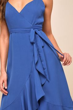 No matter the city your soiree is in, the Lulus Manhattan Moment Blue Ruffled Midi Wrap Dress is your perfect plus one! Lightweight woven fabric sweeps from adjustable spaghetti straps, into a darted bodice atop a midi wrap skit with cascading ruffles that trims the wrap silhouette and the high-low hem. Waist secures via a tying sash belt for an adjustable fit. Fit: This garment fits true to size. Length: Mid-calf length. Size medium measures 42.5" from adjustable straps to hem. Bust: Great for Blue Dresses With Adjustable Straps For Night Out, Blue Dress With Adjustable Straps For Night Out, Elegant Blue Mini Dress With Adjustable Straps, Blue Mini Dress For Bridesmaid In Summer, Blue Mini Dress For Summer Bridesmaid, Blue Summer Bridesmaid Mini Dress, Blue Knee-length Wrap Dress, Blue V-neck Wrap Dress For Beach, Blue Knee-length Midi Dress With Ruffle Hem