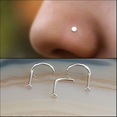 the nose has two piercings on it and is next to an image of a woman's nose