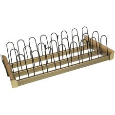 a metal rack with several pens and pencils in it on top of a white background