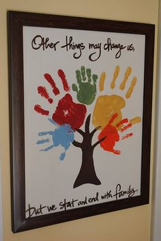 handprints are displayed on the wall in front of a sign that reads,'other things may change us but we start and end with family '