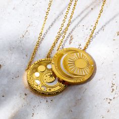 Our Celestial Coin Medallion Necklace—a captivating accessory inspired by the celestial wonders of the universe. This necklace features a stunning coin-shaped pendant crafted in gold, adorned with celestial motifs that evoke a sense of mystery and magic. With three distinct styles to choose from—moon phase, sun and moon, and evil eye—this necklace allows you to express your unique style while embracing the celestial energies that surround us. Character Accessories, Celestial Motifs, Mystical Necklace, Mantra Bracelet, Boho Tote Bag, Zodiac Rings, Wiccan Jewelry, Zodiac Bracelet, Evil Eye Earrings