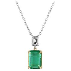 Take a look at this stunning rare vivid dark high-quality emerald and emerald cut diamond accent dangle necklace. The natural fine emerald features a vibrant strong dark green color and displays very good luster and eye clarity. Accented at the top, is an emerald-cut VS diamond. Skillfully hand set in a secure, 18K two-toned (yellow & white gold), four-prong setting. Stationary 18-inch, 18K white gold, cable chain included. Setting Style: Prong Setting Material: 18K Yellow & White Gold Main Ston Emerald Diamond Necklace, Diamond Gold Necklace, Emerald Style, Dangle Necklace, Emerald Cut Diamond, Dangle Necklaces, Gold Diamond Necklace, Vs Diamond, Diamond Gold