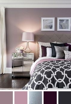 a bedroom with purple walls and black and white bedding, two framed pictures on the wall