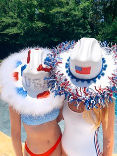 two women in bathing suits wearing patriotic hats