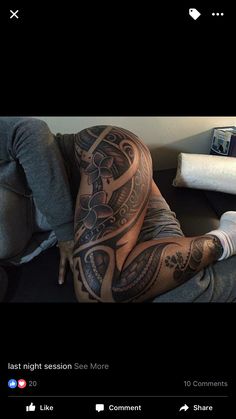 a man laying on top of a couch covered in tattoos