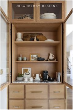 an open bookcase with wooden shelves filled with items