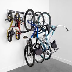 there are many bikes hanging on the wall