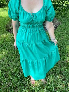 This green puff sleeve tiered midi dress is absolutely stunning for every season. With its scoop neck tie front, pockets, and elastic waist, this dress is super comfy while being incredibly classic. Wear it to work, church, brunch, running errands, date night - I mean, the possibilities are endless. Pair with wedges, fun jewelry, and make it your own! We love a blank slate dress like this! Brand: Skies are BlueDescription: Green dress with tie scoop neck; pockets; tieredFit Info: Runs a little o Midi Dress Chic, Midi Dress With Pockets, Classic Wear, Puff Sleeve Midi Dress, Blank Slate, Short Puff Sleeve, Fun Jewelry, Tiered Midi Dress, Beauty Clothes