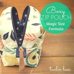 the zipper pouch is made from fabric and has a small tassell on it