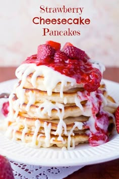 a stack of pancakes with strawberries on top