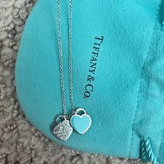 Return To Tiffany - In Silver, Tiffany Blue With A Diamond, Mini Worn A Few Days Perfect Condition With Original Packaging Blue Luxury Necklace For Valentine's Day, Luxury Blue Jewelry For Valentine's Day, Luxury Blue Heart-shaped Necklace, Elegant Blue Double Heart Necklace, Return To Tiffany, Tiffany Blue, Tiffany & Co., Blue And Silver, Heart Pendant