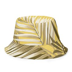 Reversible Bucket Hat, Palm Tree Brown And White Leaves With Yellow Background Minimalist Art. This reversible bucket hat can be worn on both sides, making it easy to match with different outfits. Made of breathable premium fabric, this hat will become your go-to streetwear accessory. • 100% polyester • Fabric weight: 8.1 oz/yd² (275 g/m²) • Moisture-wicking and breathable fabric • Linen feel material • Reversible • Available in 2 sizes • Blank product components sourced from China Reversible Bucket Hat For Beach, Reversible Hats For Vacation, Reversible One Size Fits Most Bucket Hat, Yellow Reversible Sun Hat For Beach, Reversible Short Brim Bucket Hat For Vacation, Casual Yellow Reversible Sun Hat, Yellow Reversible Hat One Size Fits Most, Trendy Reversible Adjustable Bucket Hat, Reversible Curved Brim Bucket Hat For Vacation