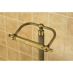 an old fashioned brass towel rack in a bathroom