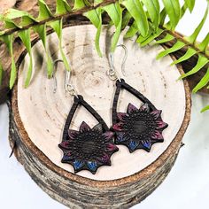 Add a pop of color to any outfit with our handcrafted Flower Dangle Earrings. Made with beautiful, multicolored American hardwood and hypoallergenic hardware, they're the perfect gift for any occasion. These handmade earrings measure:2 inches or 5.1 CM including hook. Multicolored - may have small batch color variation. Bohemian Hand Painted Purple Earrings, Purple Flower Bohemian Earrings, Hand Painted Multicolor Dangle Flower Earrings, Handmade Bohemian Flower-shaped Earrings, Whimsical Multicolor Flower-shaped Earrings, Flower Dangle Earrings, Small Batch, Flower Crafts, Handmade Earrings