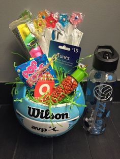 a basket filled with toys and water bottles