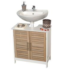 a white sink sitting on top of a wooden cabinet