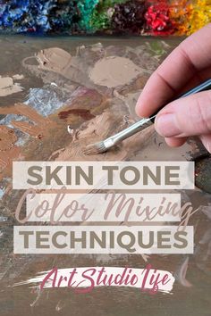 a hand holding a paintbrush in front of a painting with text that reads skin tone color mixing techniques art studio life