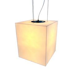 a white light that is on top of a square box with wires attached to it