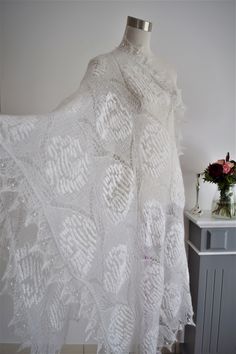 Beautiful lace rectangular shawl is made in Estonian old style with traditional patterns. Very soft, lacy stole made of high quality fine yarn (mohair, silk). Has a light, fluffy texture, very pleasant to the skin. Makes you warm and cozy, yet elegant! Perfect for bridal outfit! Colour: white Size approx : 80 cm x 200 cm -15 cm) Material: 30 % soie 70 % kid mohair One more wedding shawl looking for here https://www.tricoteart.com/listing/572080177/chale-dentelle-romantisme-en-mohair White Lace Shawl For Wedding, White Lace Shawl With Lace Work, White Lace Wedding Shawl, Cream Lace Wedding Shawl, White Lace Shawl With Lace Trim, Cream Crochet Lace Shawl, White Lace Shawl, Bridal Outfit, Wedding Shawl