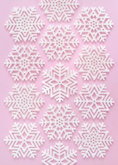 white snowflakes are arranged on a pink background with space for the wording