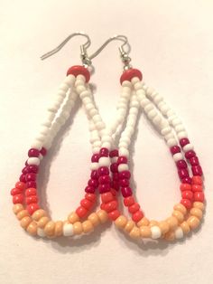 Beaded dangle earrings, rustic and western pattern Southwestern Style White Jewelry With Dangling Beads, Rustic Beaded Dangle Jewelry, Southwestern Style White Beaded Dangle Earrings, Southwestern White Teardrop Earrings, Rustic Multicolor Beaded Jewelry, Handmade Rustic White Jewelry, White Round Bead Southwestern Earrings, White Rustic Handmade Jewelry, Rustic Handmade White Jewelry