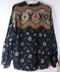 "80's Women's Shirt Long Sleeve 100% Rayon Button Down Geo Southwestern Paisley Tribal Graphic Mix Excellent Vintage by HUTSPAH USA Size M Cool, chic, rich. Blacks browns neutrals make up this wild mix of graphics, cadet collar,black buttons. Gorgeous light drapey fabric. Super high quality. Excellent vintage condition. Easy to wear casual chic vintage for the disco sporting life. MEASUREMENTS: Length- 28.5\" Width (underarms to underarms) 22.5\" Sleeve (shoulder to cuff) 23\" MODEL STATS: Ht. - Bohemian Fall Shirt With Button Closure, Bohemian Patterned Tops With Button Closure, Vintage Button-up Top With Paisley Print, Vintage Paisley Print Button-up Top, 80s Mens, Chic Vintage, Shirt Long Sleeve, Black Button, Vintage Chic