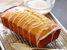 a loaf of cake sitting on top of a cooling rack