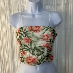 Condition: Great, Never Worn Brand: Fashionnova Size: Medium Color: Floral Print Material: 92% Nylon, 8% Spandex Measurements: * Length: 10” * Chest: 30” Multicolor Ruched Sleeveless Top, Multicolor Ruched Tops For Vacation, Spring Tropical Print Crop Top, Tropical Print Crop Top For Spring, Ruched Crop Top For Spring Vacation, Fitted Tropical Tops For Spring, Tropical Spring Tops, Pink Ruched Top For Vacation, Fitted Tropical Print Crop Top For Summer