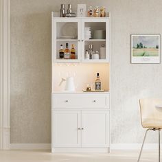 a white cabinet filled with bottles and glasses