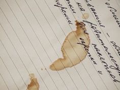 a piece of paper with writing on it that has been torn off and inked