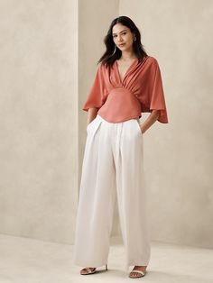 Open-Back Blouse | Banana Republic Factory Versatile V-neck Viscose Blouse, Flowy V-neck Top For Work, Elegant White V-neck Top For Work, Elegant V-neck Blouse For Summer, Elegant V-neck Blouse For Brunch, Elegant Blouse With Draped Sleeves, Elegant Formal V-neck Top, Formal Silk Blouse With Draped Sleeves, Elegant Formal Tops With Draped Sleeves