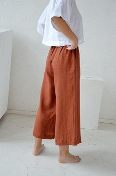 Casual Brown Linen Wide Leg Pants, Brown Linen Wide Leg Bottoms, Spring Brown Linen Wide Leg Pants, Brown Linen Wide Leg Pants For Spring, Brown Wide Leg Linen Bottoms, Brown Linen Wide Leg Pants With Pockets, Brown Linen Wide Leg Pants For Summer, Flared Linen Pants